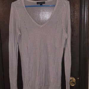 Long sleeved gray shirt with crosses on it